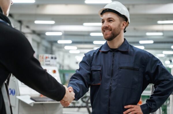 Man in Factory Is Making a Deal