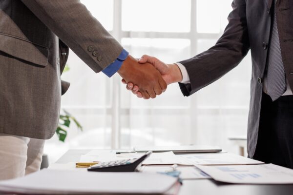 Business Handshake to Congratulate Successes